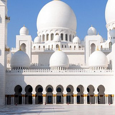 Part of this truly amazing building in Abu Dhabi.Covered in pure white marble,it was built with no cost spared. Some of the 54 domes can be seen,with the one on the right being the largest dome in the world.<br> © john willis<br>Photo selected by <a href="http://bitofinspiration.com"> bitofinspiration.com</a>. <br>For link to original source visit <a href="http://www.flickr.com/photos/22515170@N03/4685981962" >flickr </a> 4685981962.jpg