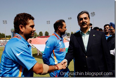 Prime Minister Syed Yusuf Raza Gilani of Pakistan shakes hands with Sachin Tendulkar of India as Prime Minister Manmohan Singh of India looks on prior to the start of the 2011 ICC World Cup second Semi-Final