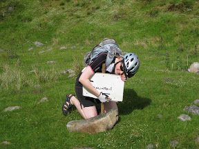 this was the only trail sign we ever saw.  we were following a single-trail dirt path and at some point, you need to break from the trail and head around a hill to pick up another trail.  however, with the stream breaking things up every 50-100 feet, this is hard to do.  someone with kind mountain biker goodwill must have posted this. thank you!