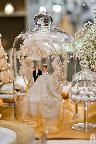 A wreath-embellished topper served as the centerpiece for the main dining table. A wreath-embellished topper served as the centerpiece for the main dining table.