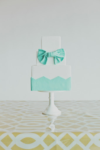 Why not have a cake that matches your dress? A sweet accessory indeed!