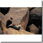 Writer on rocks