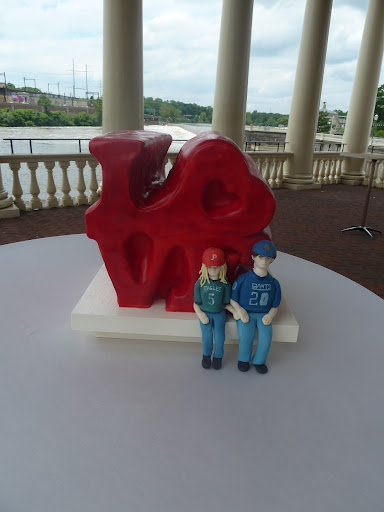 And the groom's cake, which featured edible figurines of the bride and groom in their favorite sportswear. And the groom's cake, which featured edible figurines of the bride and groom in their favorite sportswear.