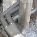 This is the header next to my new collector pipe. The new pipe has a slightly smaller ID, which should be better for my torque curve.
