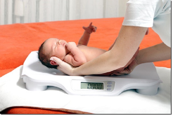 baby boy on weight scale