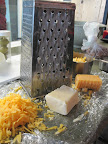 And now, grate the cheese. And now, grate the cheese.