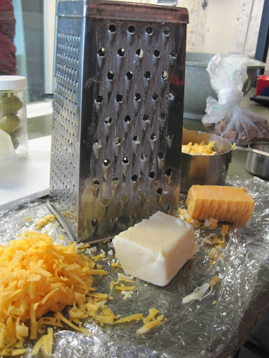 And now, grate the cheese. And now, grate the cheese.