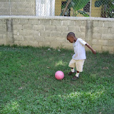 Wilton kicks the ball across the yard.