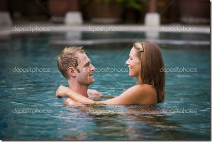 attractive couple in swimming pool attractive couple in swimming pool