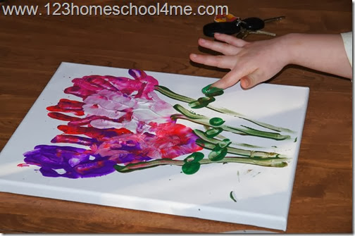 use finger to add stems and leaves with green paint use finger to add stems and leaves with green paint