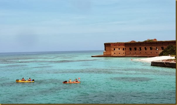 Kayakers circumnavigating the main island with Fort Jefferson in the background