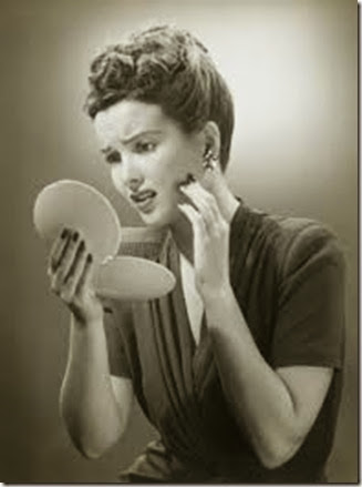 woman-looking-in-mirror-vintage-e1343019650424