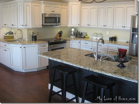 black island, white cabinets, granite