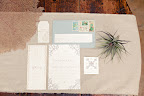 The invitation suite incorporated subtle nautical touches like a compass rose. The invitation suite incorporated subtle nautical touches like a compass rose.
