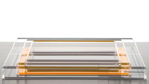 I love the subtle orange in these Lucite trays. (alexandravonfurstenburg.com)