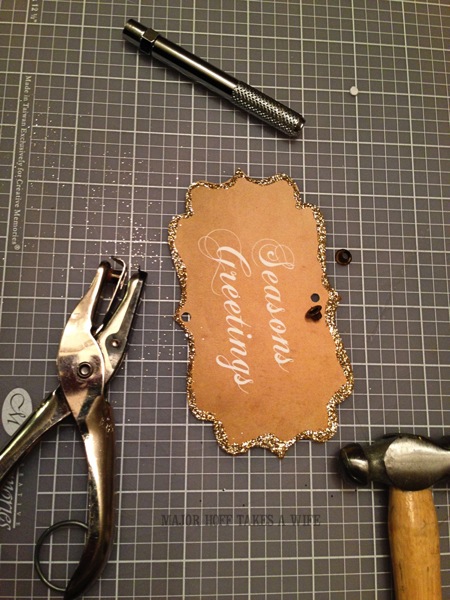 Adding grommets to homemade paper Holiday ornaments Adding grommets to homemade paper Holiday ornaments