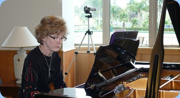 Denise Gunson playing a solo piece on the grand piano. Photo courtesy of Dennis Lyons.