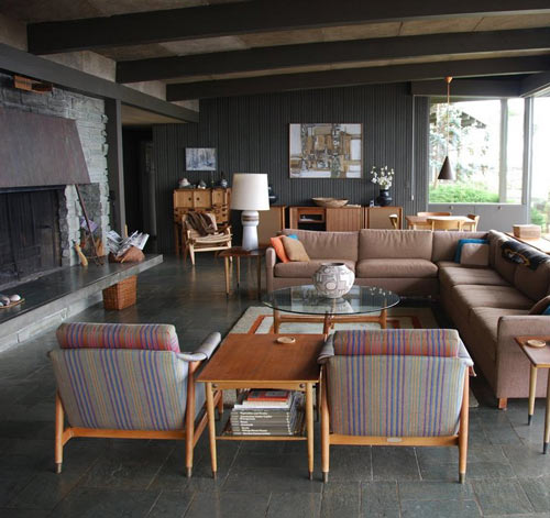 The dark walls and slate flooring here provide a perfect canvas for mauves and sunset oranges. (www.designsponge.com) The dark walls and slate flooring here provide a perfect canvas for mauves and sunset oranges. (www.designsponge.com)