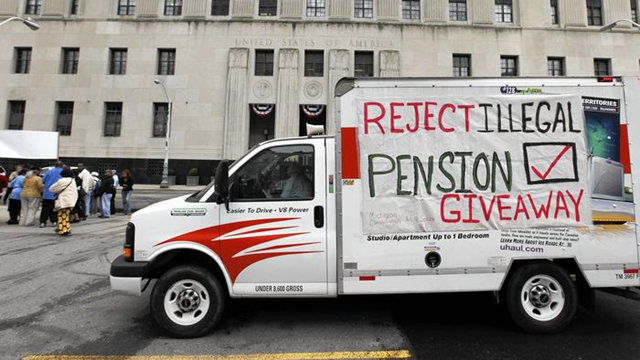 City retirees protest near the federal courthouse in Detroit on 3 July 2014. The city's bankruptcy plan would cut the pensions of nonuniform retirees by 4.5 percent. Photo: Paul Sancya / Associated Press