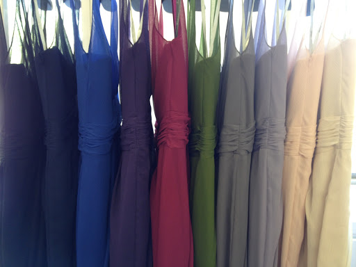 A rainbow of bridesmaid dresses. A rainbow of bridesmaid dresses.