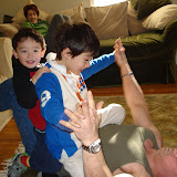 Eidan and Kai wrestling with Uncle Paul