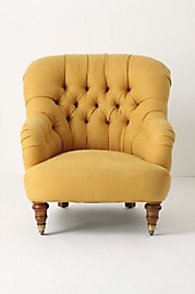 Mustard yellow gives a great punch of color to this comfortable chair.
(anthropologie.com)