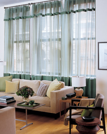 Create tone-on-tone sophistication by trimming silk-organza sheers with linen in a slightly deeper shade. Green linen panels on silk-organza sheers give just the right touch of color to a living room dressed in neutral hues.