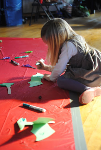 We ran out of table space so taped a plastic tablecloth to the floor for more crafting space. We ran out of table space so taped a plastic tablecloth to the floor for more crafting space.