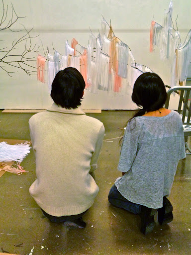 Nicholas Andersen and Julie Ho of Confetti System assess their ceremony marker.