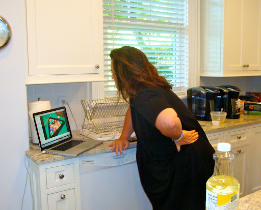 Rosie checking out a photo of the cupcakes Spot submitted to the contest