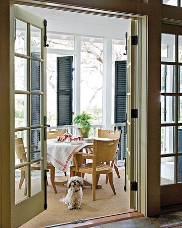 Classic shutter doors keep this Southern porch cool during the hottest months. (Martha Stewart Living) Classic shutter doors keep this Southern porch cool during the hottest months. (Martha Stewart Living)