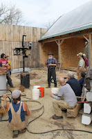 Lou Host-Jablosnki of Design Coalition explains the clay dispersion process to the cew