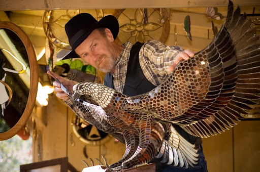 'Craft in America' aired on PBS and will be on display at Silver Dollar City for six weeks.  Above, artist Eddie Hesalroad of Greene, Iowa, displays his stained glass eagle. (Photo courtesy of Silver Dollar City)