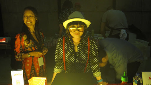I'm not sure what this lady was serving but she had a cool outfit on.