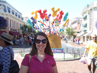Debs in Front of the Happy Birthday Stand at Disneyland