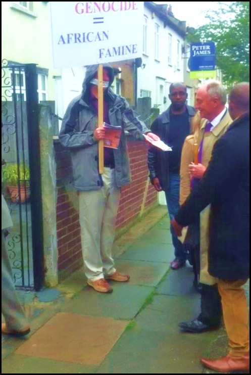 LIVINGSTON KEN ex-London mayor REFUSING BOERS IN EXILE PAMPHLET DURING DEMO JACK HINDON SCOUTS MAY LONDON 2012