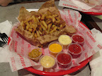 The secret to Spike's fries: aging potatoes so the starches turn to sugar.  The many mayo dips don't hurt either.