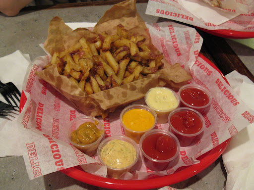 The secret to Spike's fries: aging potatoes so the starches turn to sugar.  The many mayo dips don't hurt either.