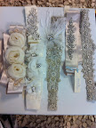 What gorgeous belts! One would dress up a simple gown in seconds; they range from $100 to $800. Go to Modern Trousseau's website to find out when they can be purchased.