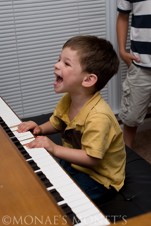 Scott smiling at piano blog