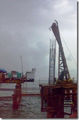 Lowering of reinforcement cage in pile casing Marine piling
