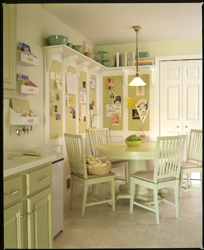 Pin-up boards installed in this family's kitchen organize kids' art work and school papers. Pin-up boards installed in this family's kitchen organize kids' art work and school papers.