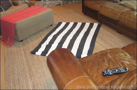 striped towel layered on rug