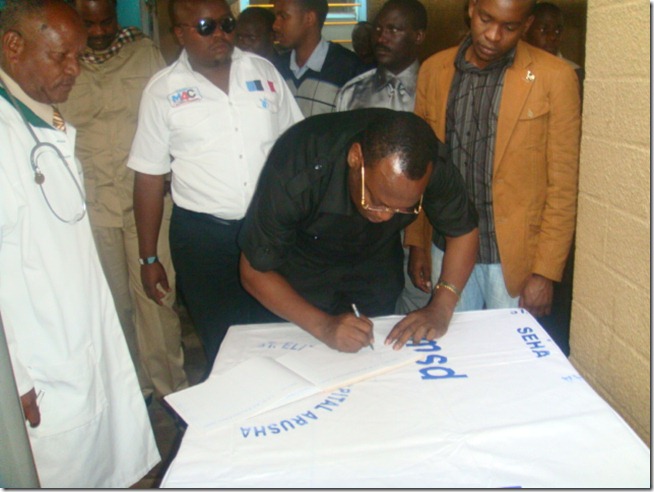 Mbowe signs visitors book at St Elizabeth hospital
