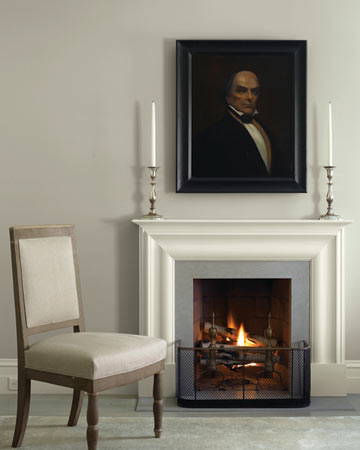 Above the bedroom's fireplace hangs a painting of Daniel Webster, a Massachusetts senator in the mid-1800s and an ancestor of Eric's. Above the bedroom's fireplace hangs a painting of Daniel Webster, a Massachusetts senator in the mid-1800s and an ancestor of Eric's.