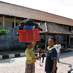 Women carrying heavy divegear to US Liberty wreck divesite (Tulamben, Bali)