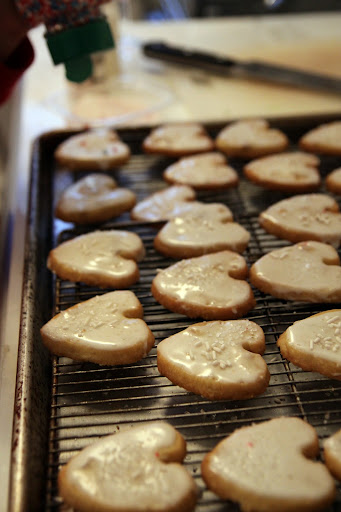 Glazed hearts with first layer of sprinkles