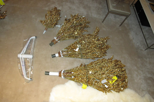 Taking apart the box of the Christmas tree and laying out the branches.