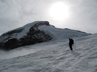 A fresh dump of snow coating the trail (in August!)... sun starting to break through.
