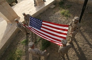 c0 Marines unfurl an American Flag